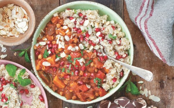 a bowl of Moroccan-inspired tagine with sweet potato, harissa, tomato, zucchini, and chickpeas