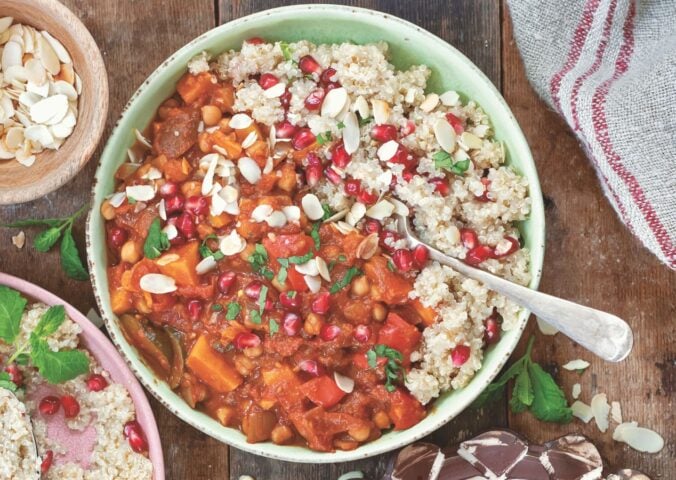 a bowl of Moroccan-inspired tagine with sweet potato, harissa, tomato, zucchini, and chickpeas