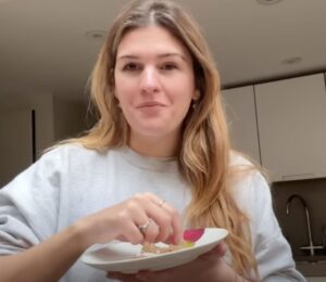 A still of Nicole Whittle, also known as Vegan Beauty Girl, from a recent video on accessible vegan meals