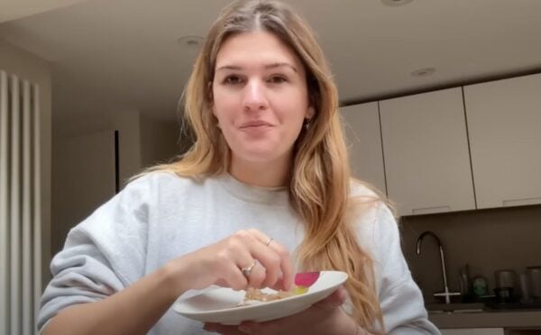 A still of Nicole Whittle, also known as Vegan Beauty Girl, from a recent video on accessible vegan meals