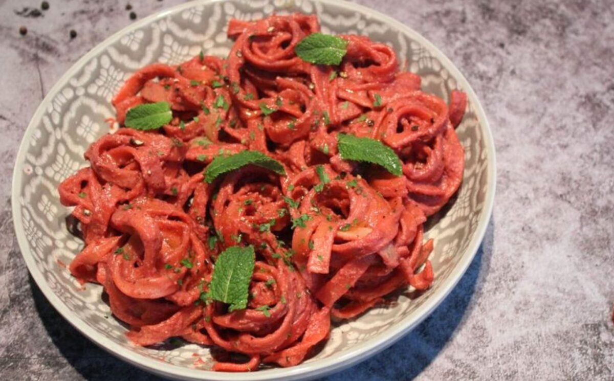 A dish of creamy vegan beetroot pasta