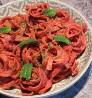 A dish of creamy vegan beetroot pasta