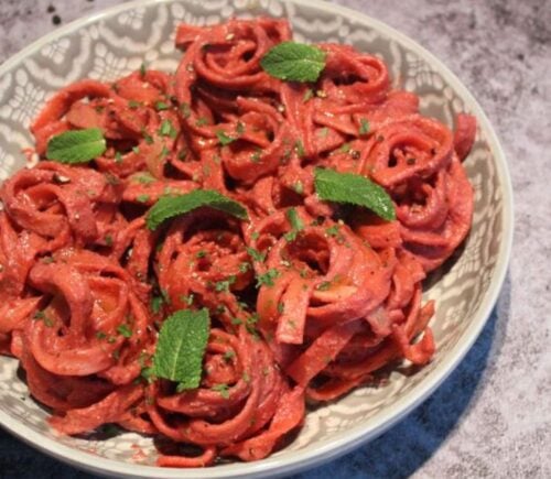 A dish of creamy vegan beetroot pasta