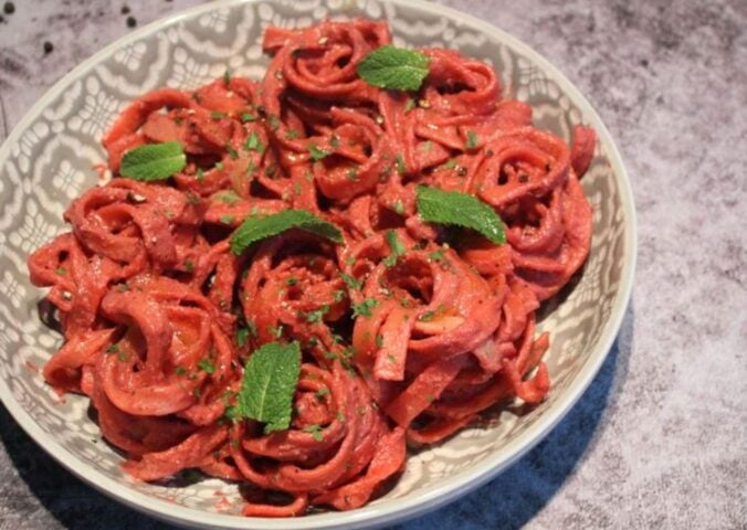 A dish of creamy vegan beetroot pasta