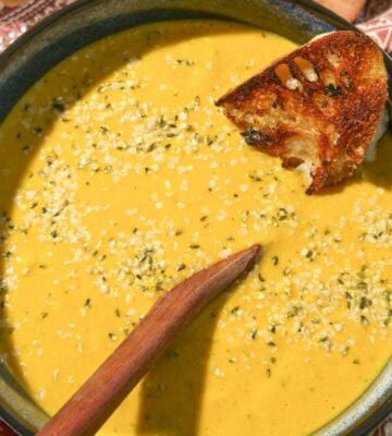 a vegan broccoli cheddar soup with bread