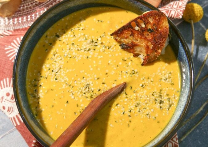 a vegan broccoli cheddar soup with bread