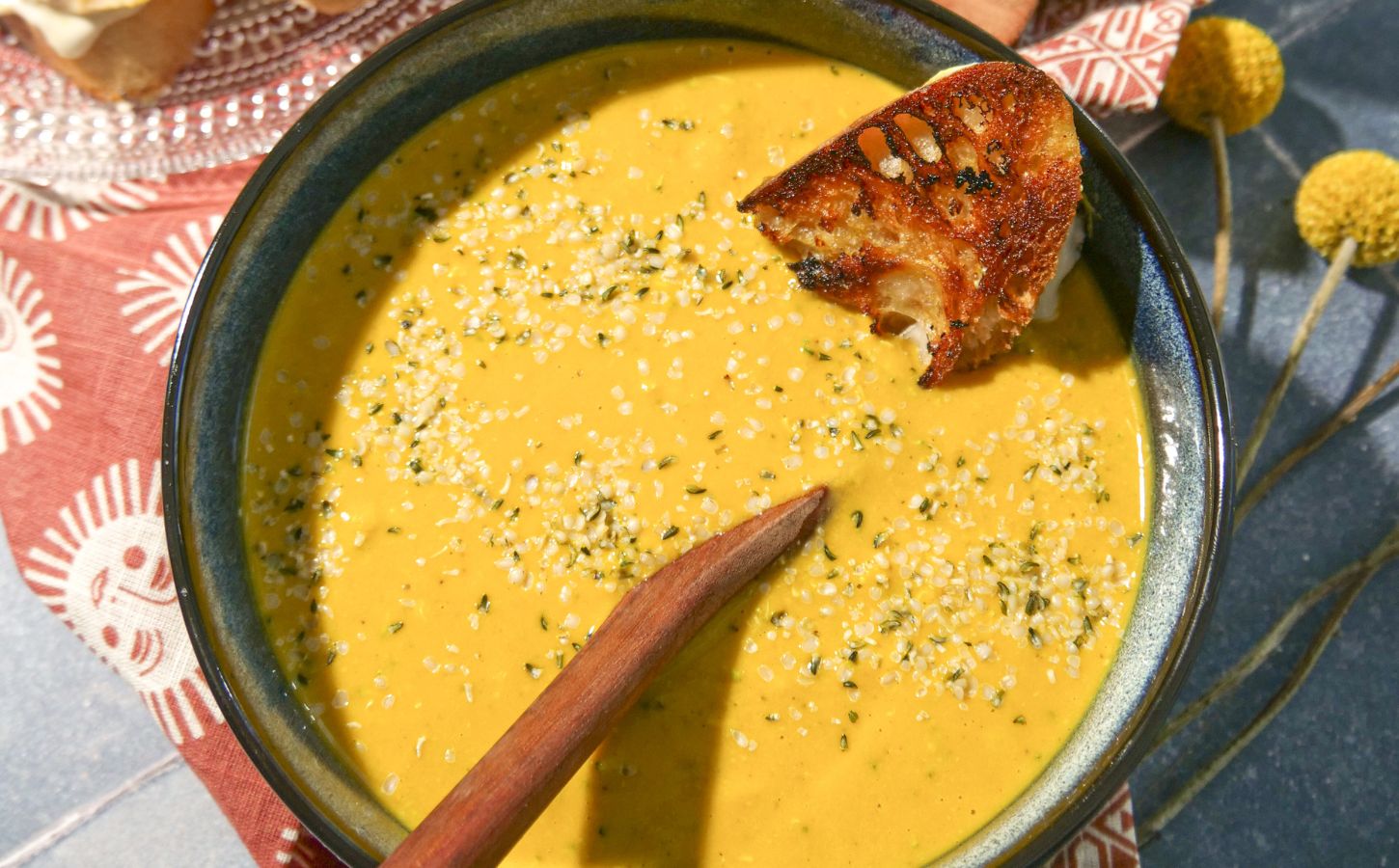 a vegan broccoli cheddar soup with bread