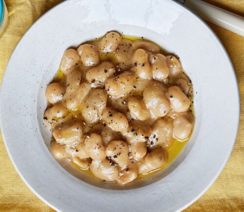 a bowl of cacio e pepe-style butterbeans