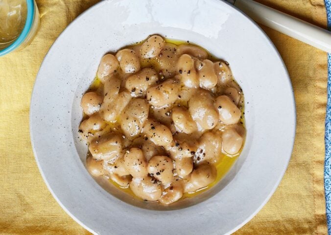 a bowl of cacio e pepe-style butterbeans