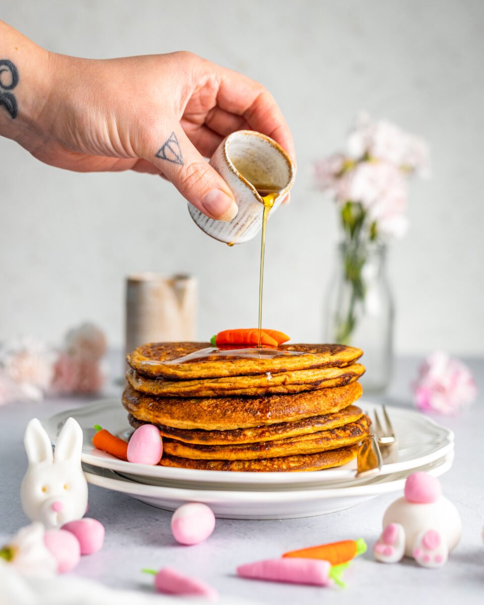 a stack of carrot cake pancakes with cinnamon and ginger