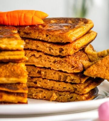 a stack of carrot cake pancakes with cinnamon and ginger