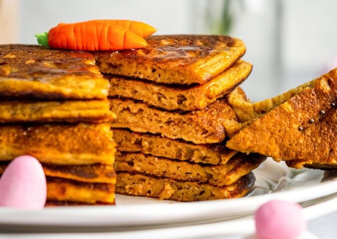 a stack of carrot cake pancakes with cinnamon and ginger