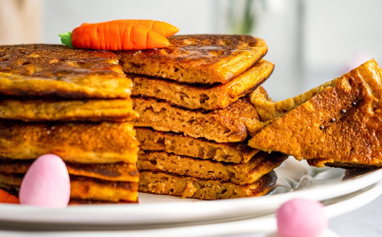 a stack of carrot cake pancakes with cinnamon and ginger