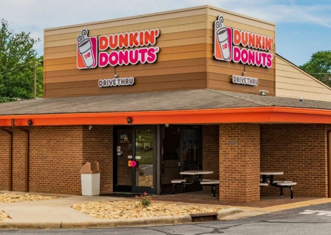 Photo shows a Dunkin' drive-through