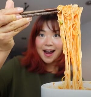 Rose Lee, who runs Cheap Lazy Vegan, eating noodles