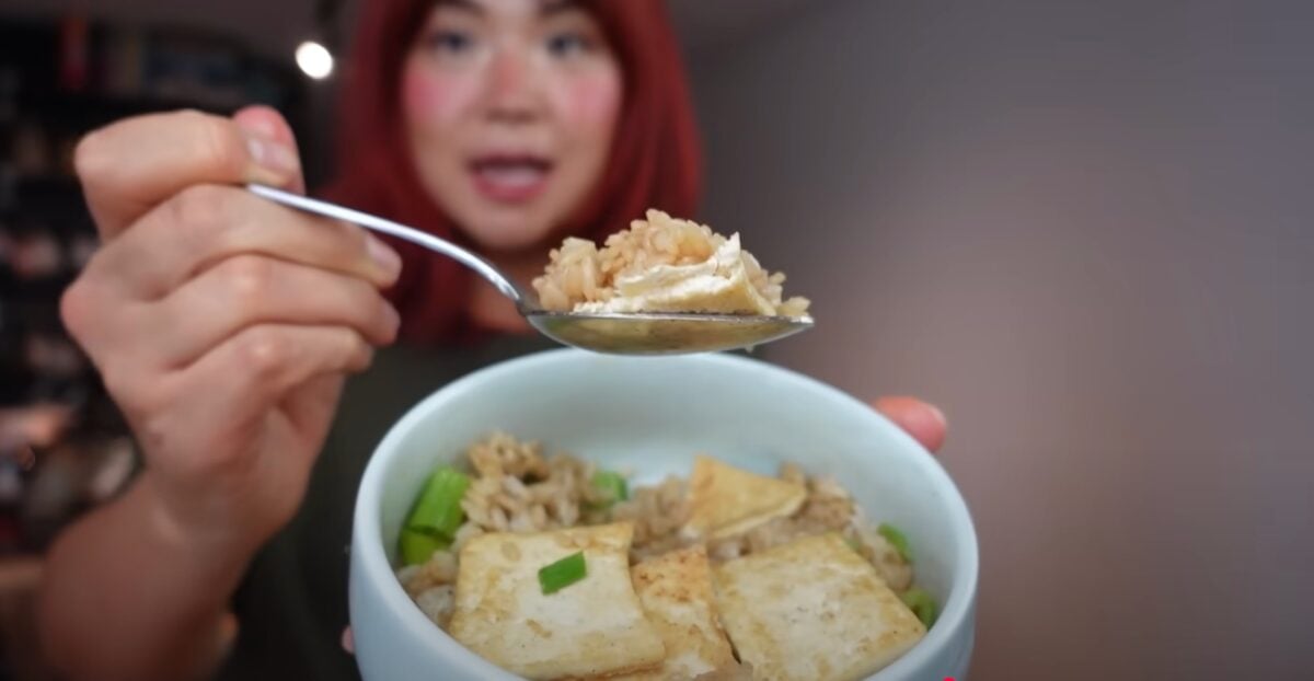 Rose Lee, who runs Cheap Lazy Vegan, eating rice and tofu