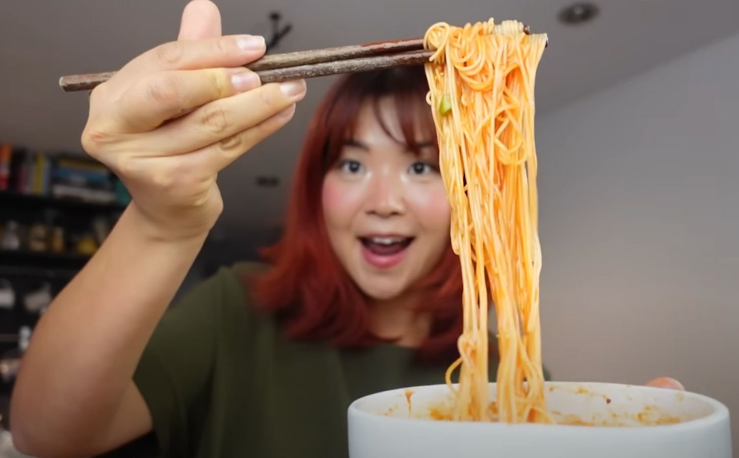 Rose Lee, who runs Cheap Lazy Vegan, eating noodles