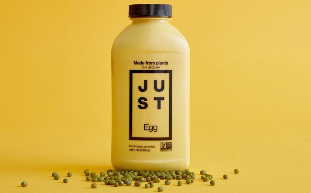 A bottle of Just Egg in front of a yellow background, a plant-based egg alternative