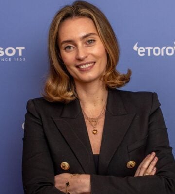 Plant-based entrepreneur Ella Mills in front of a blue background