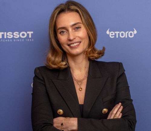 Plant-based entrepreneur Ella Mills in front of a blue background