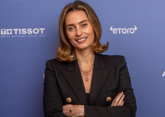 Plant-based entrepreneur Ella Mills in front of a blue background