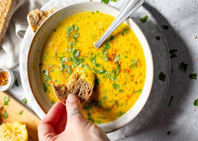 A large bowl of lemon chickpea soup from Romy London