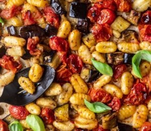 a sheet pan gnocchi alla norma with eggplant. basil, tomato, and gnocchi