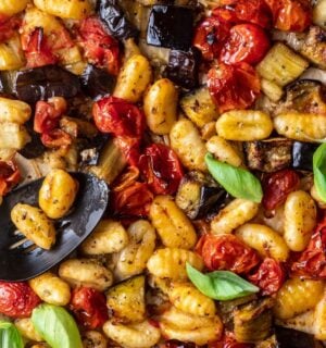 a sheet pan gnocchi alla norma with eggplant. basil, tomato, and gnocchi