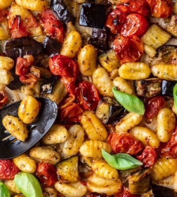 a sheet pan gnocchi alla norma with eggplant. basil, tomato, and gnocchi