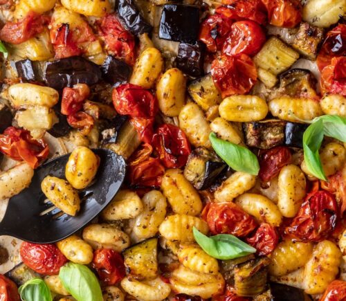 a sheet pan gnocchi alla norma with eggplant. basil, tomato, and gnocchi