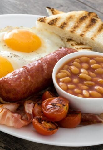 An English breakfast fry up which features sausages and eggs