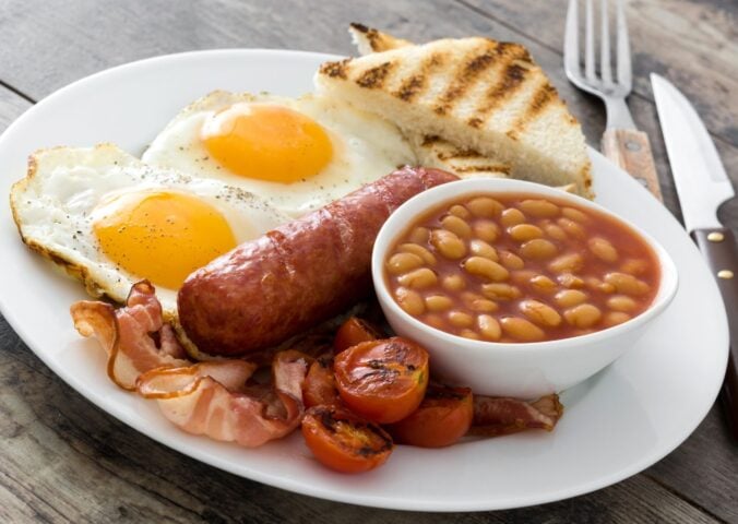 An English breakfast fry up which features sausages and eggs