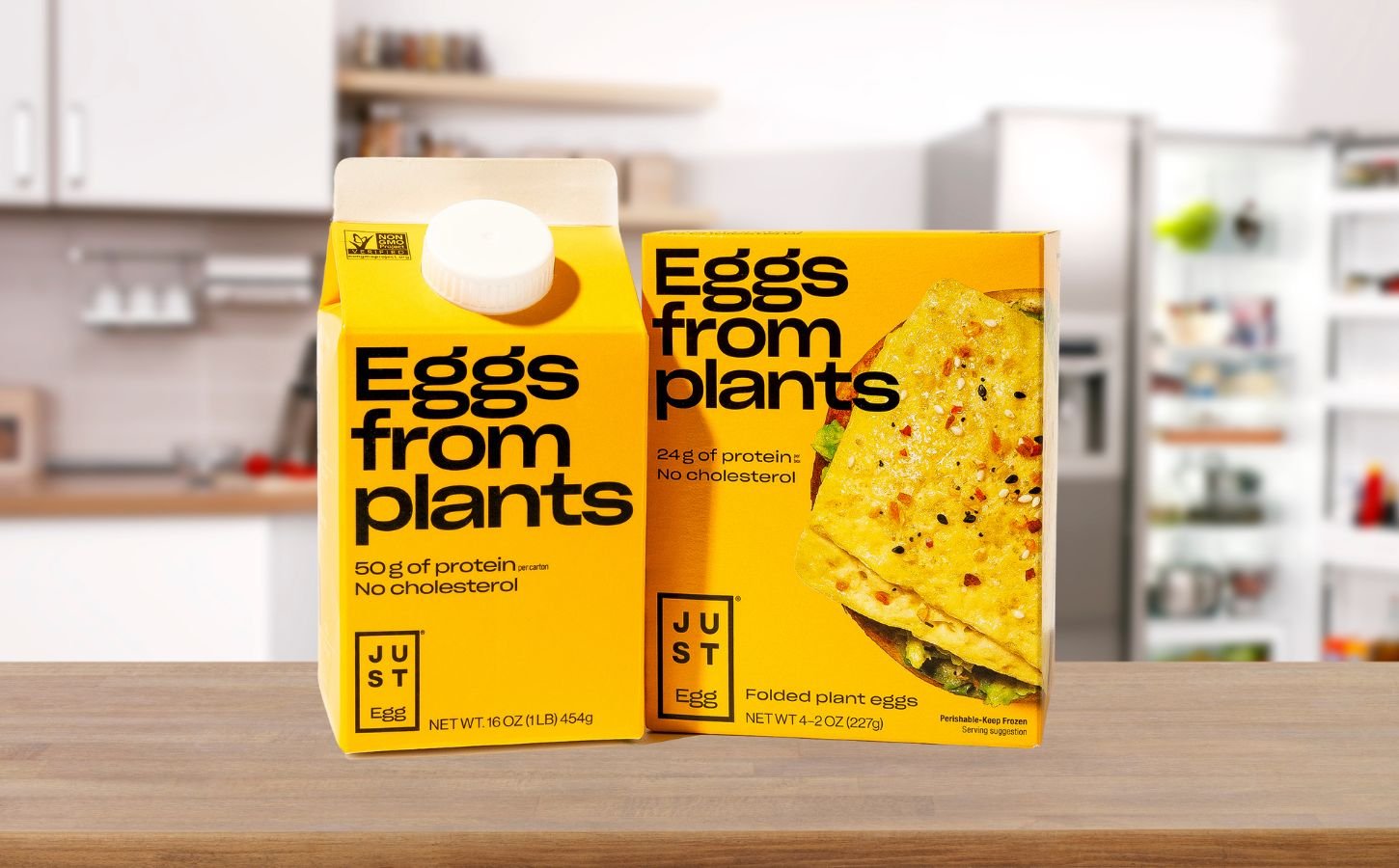 A bottle of Just Egg in front of a yellow background, a plant-based egg alternative