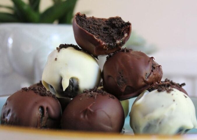 A pile of dark and white 3-ingredient vegan Oreo balls