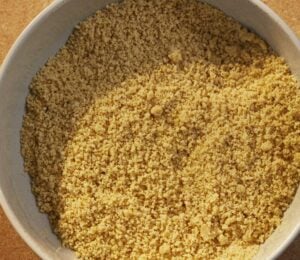 a bowl of vegan parmesan that is dairy-free and made of nuts