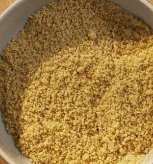 a bowl of vegan parmesan that is dairy-free and made of nuts