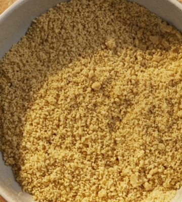 a bowl of vegan parmesan that is dairy-free and made of nuts