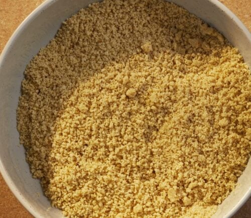 a bowl of vegan parmesan that is dairy-free and made of nuts