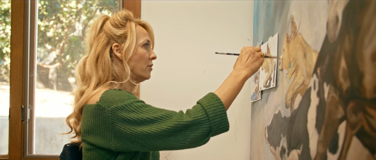 Gretchen Ryan painting an animal rights-themed painting in a still from vegan film "Liberty"