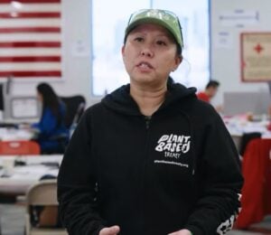 Photo shows Samantha Lau, a campaigner for Plant Based Treaty, talking about the group's collaboration with American Red Cross