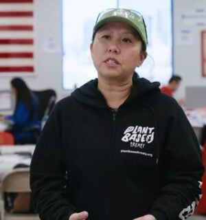 Photo shows Samantha Lau, a campaigner for Plant Based Treaty, talking about the group's collaboration with American Red Cross