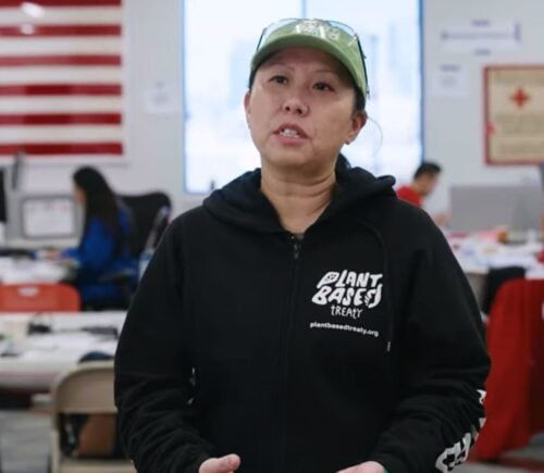 Photo shows Samantha Lau, a campaigner for Plant Based Treaty, talking about the group's collaboration with American Red Cross