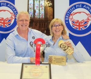 The founders of the Phat Pasty Company receiving their "Pasty of the Year" award for their vegan pasty