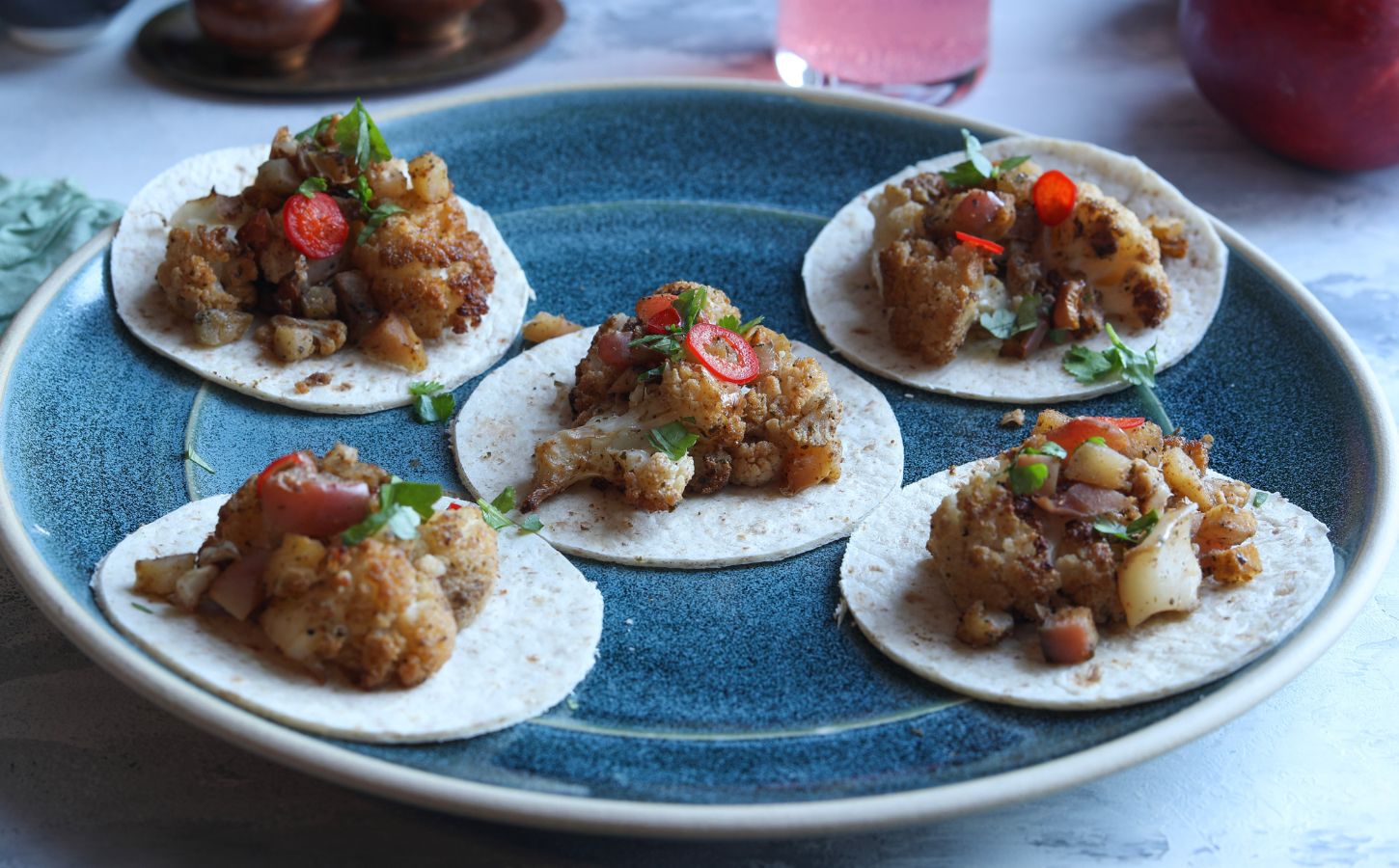 Five curried cauliflower and apple mini tacos