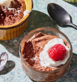 a chickpea chocolate mousse recipe with plant-based cream and raspberries