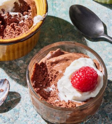 a chickpea chocolate mousse recipe with plant-based cream and raspberries