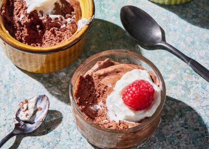 a chickpea chocolate mousse recipe with plant-based cream and raspberries