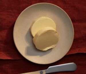 A plate containing dairy-free butter made to a vegan recipe