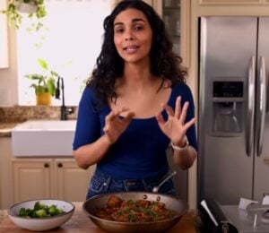 A still of Nisha Vora with the one dish she'd make to impress a tofu skeptic