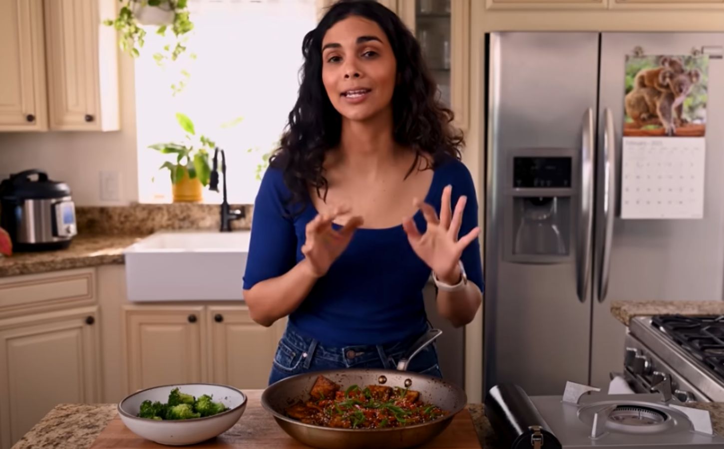 A still of Nisha Vora with the one dish she'd make to impress a tofu skeptic